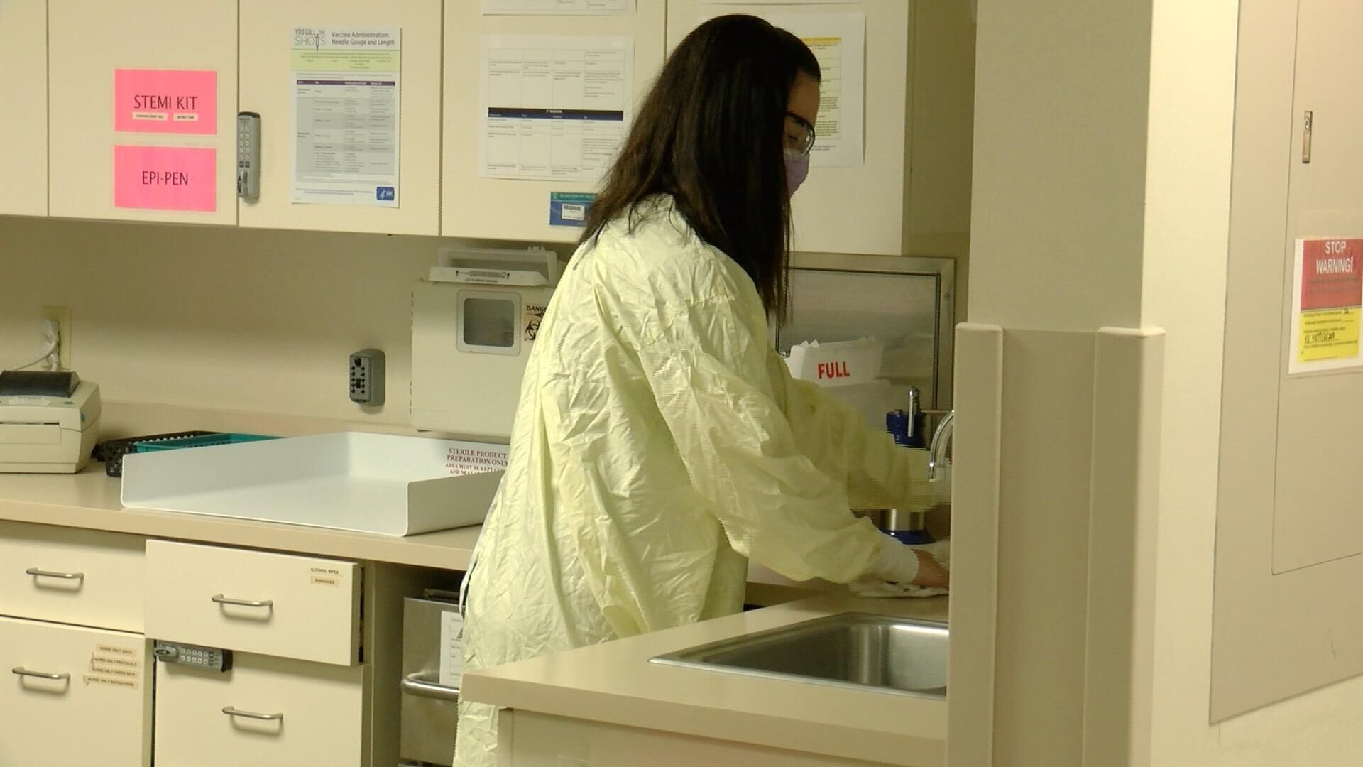 Jenny Bedenbaugh, RN - Prepares to administer a COVID-19 test.